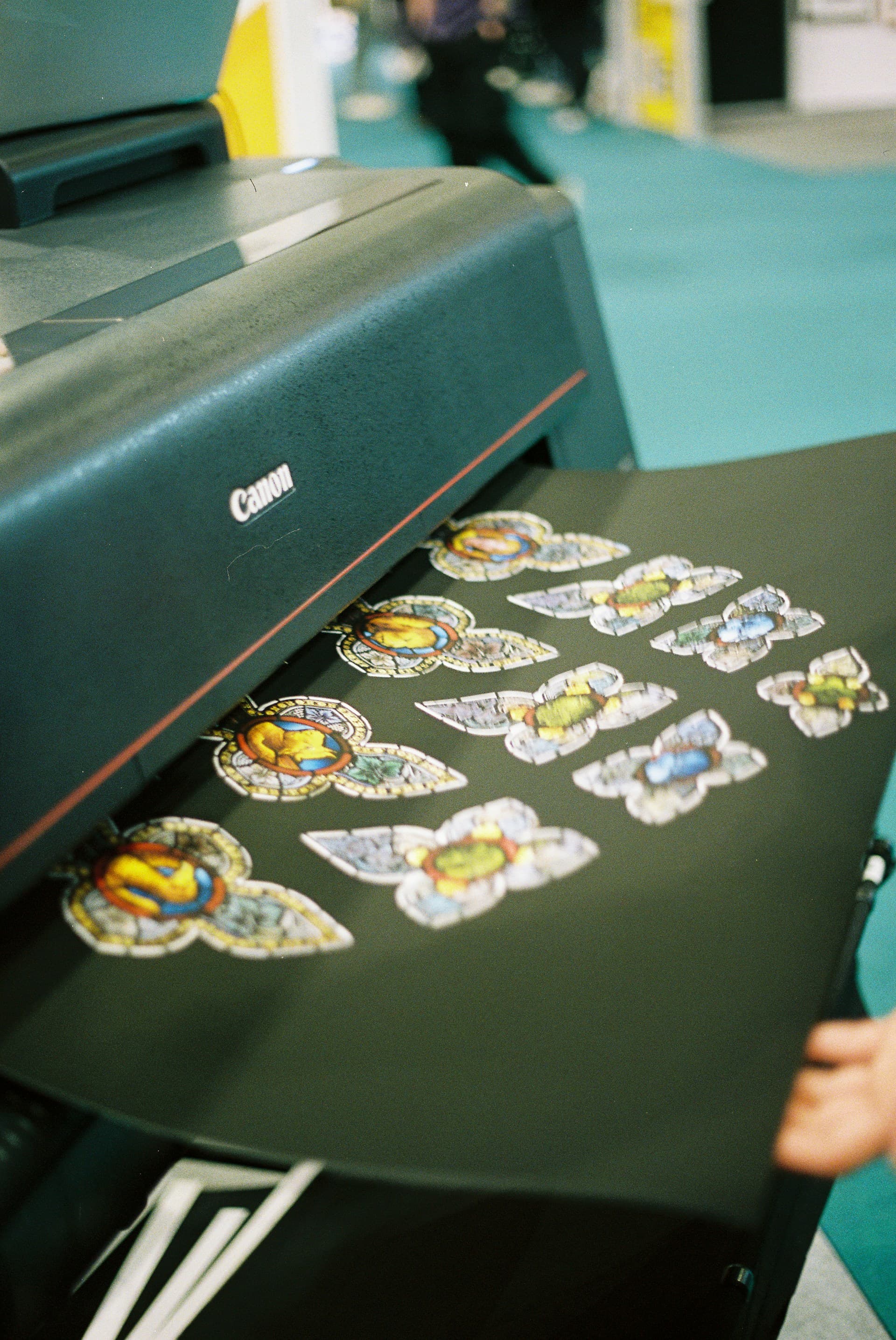Print-on-demand sticker production — custom labels and stickers being printed